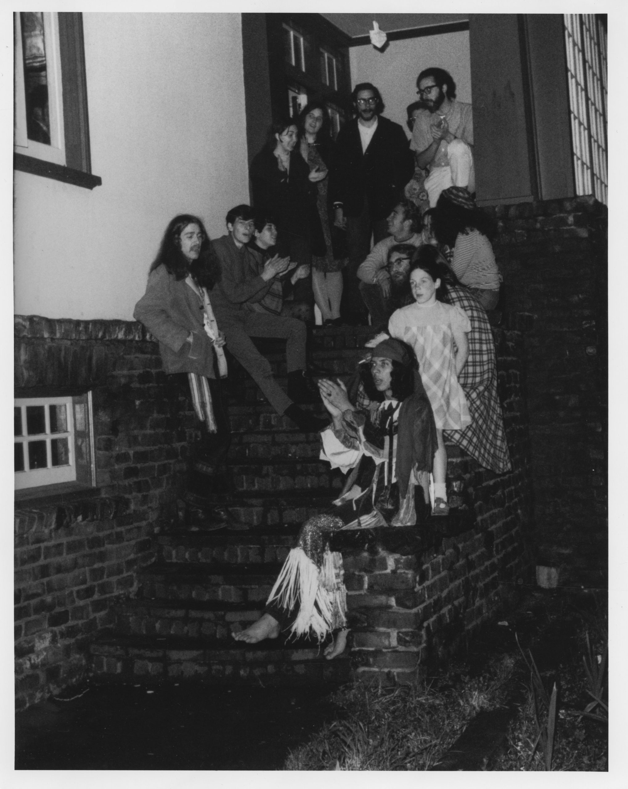 A group of hippies sitting on the front steps of the original House of Love and Prayer at 347 Arguello Blvd, circa 1969. Photograph by Marvin Kussoy, courtesy of Yehudit and Reuven Goldfarb.